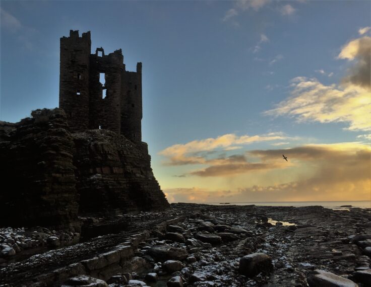 Sunrise at the ruins of Keiss Castle on the cliffs of Caithness