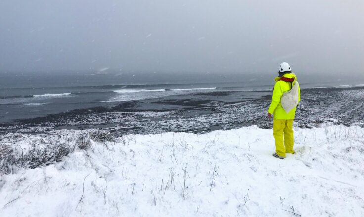 Assessing conditions on a snowy at start of a seaweed harvest in Caithness Scotland